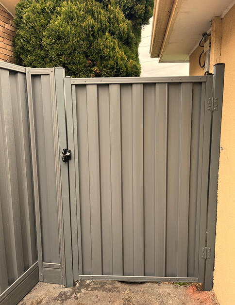 SawScreen Colorbond fence in Paperbark and Basalt with timber sleepers installed in Cranbourne North