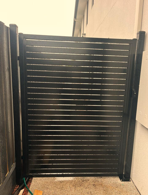 black aluminium slat single gate installed for a new build property in Dandenong