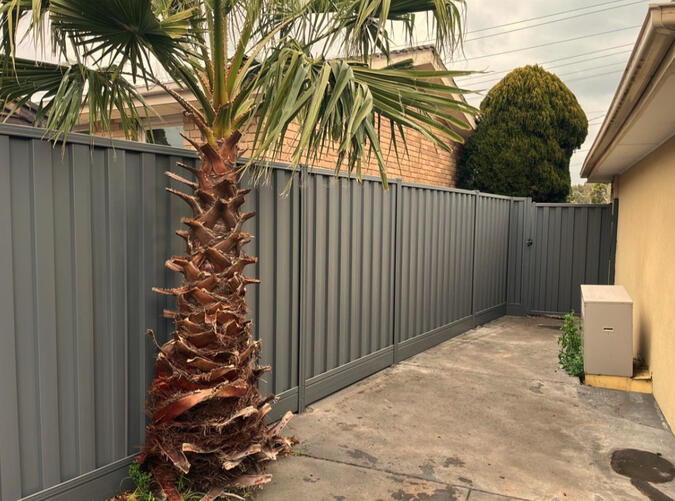 Colorbond fence Basalt with aluminium sleepers installed in Noble Park North